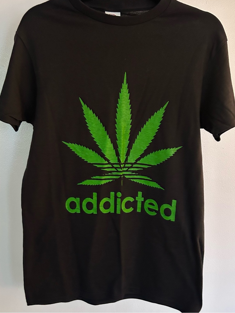 Black Graphic Tee with Green Leaf Print